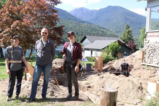 Ellenwood Homes crew members Jessica McLeod, Marc Brillon and Meredith Vezina stand at a jobsite on the North Shore of Kootenay Lake.