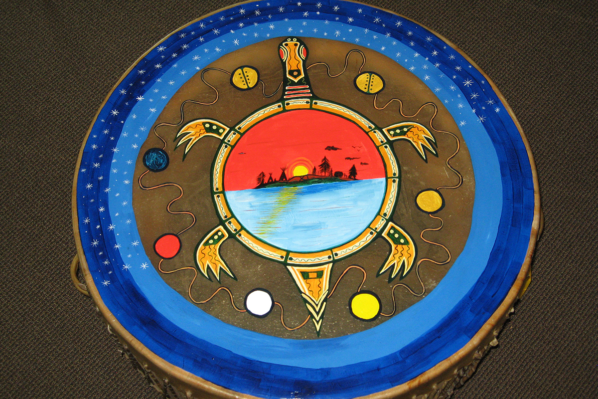 An image of drum with a turtle painted on the drum skin