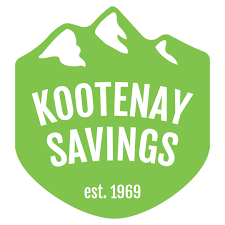 A green shield with mountain caps and the words &quot;Kootenay Savings&quot;