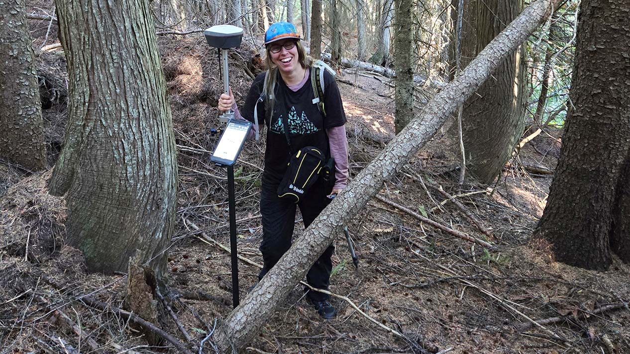 Alumna Alana Block works in the forest