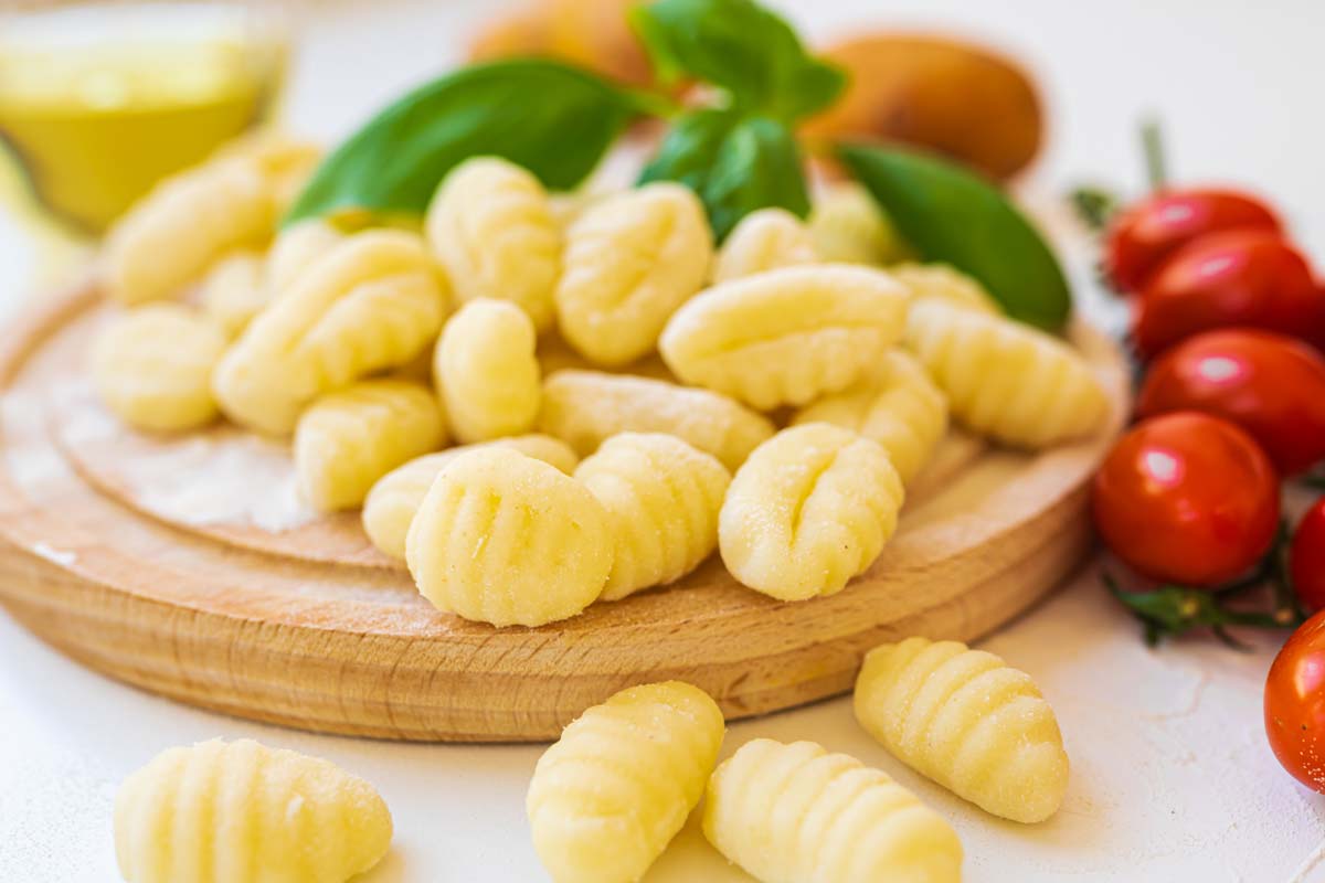 Dried gnocchi with basil and mini tomatoes