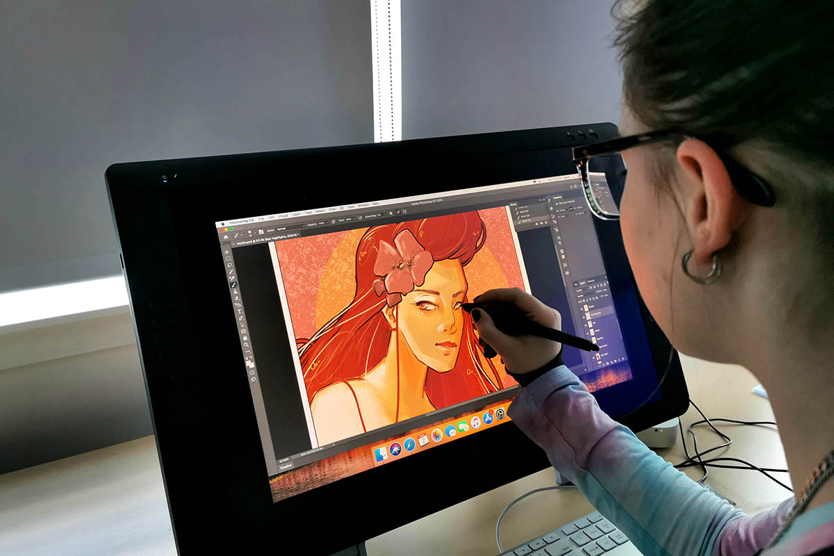 student working on digital art