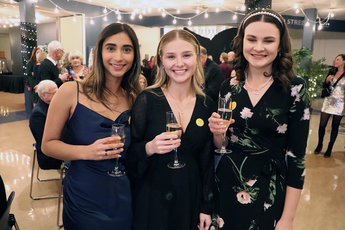 Students stand together at Gala