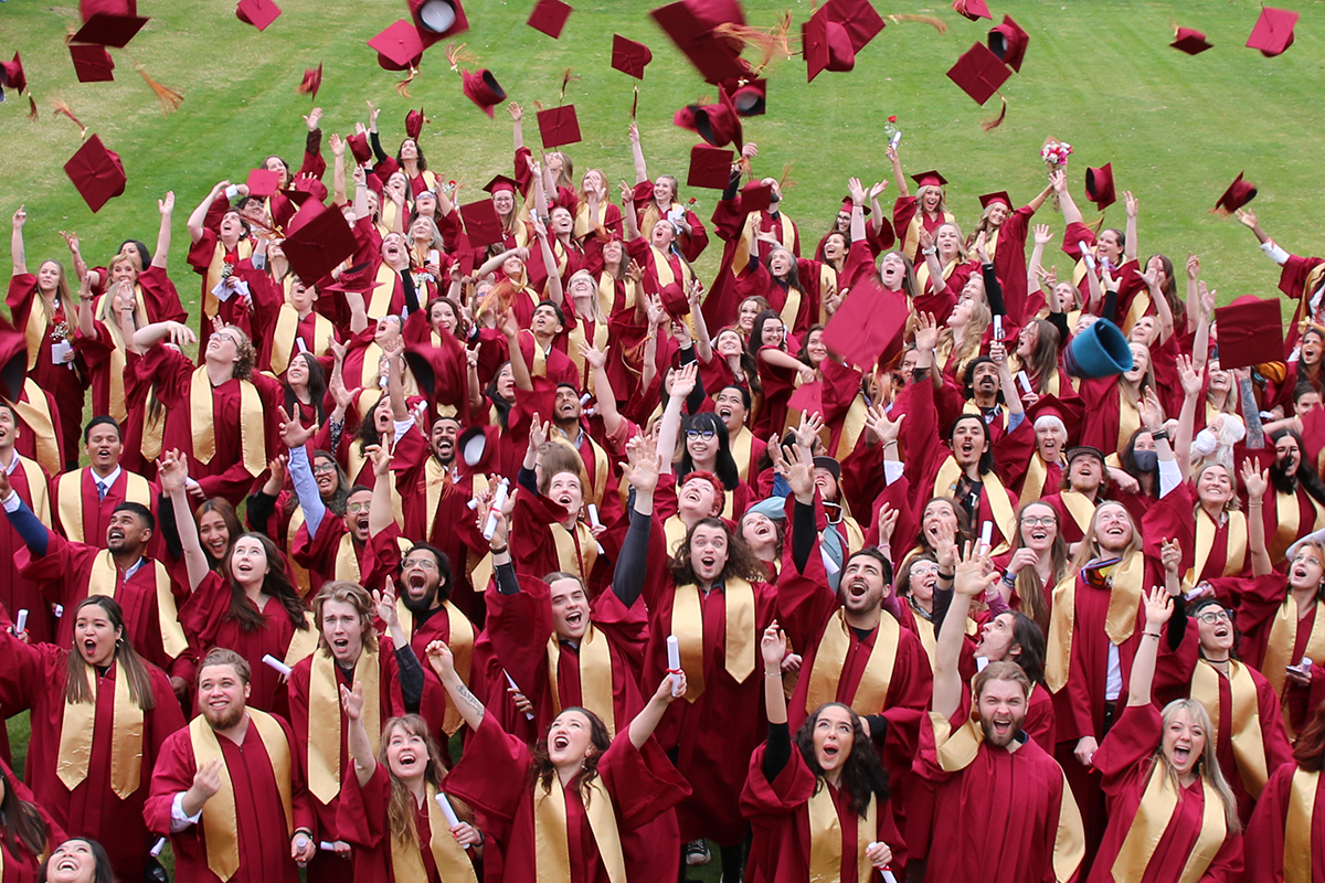 Celebrating convocation with hat toss