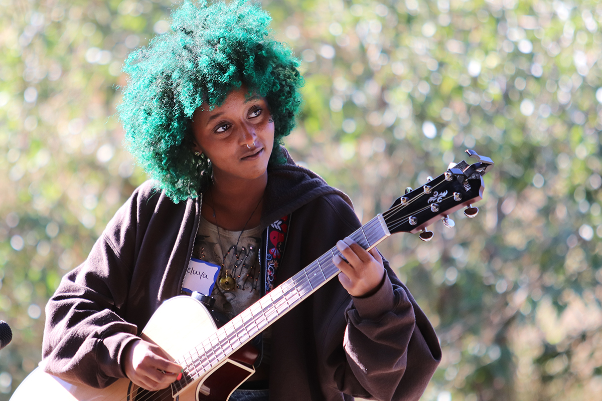 Haleluya Hailu playing guitar