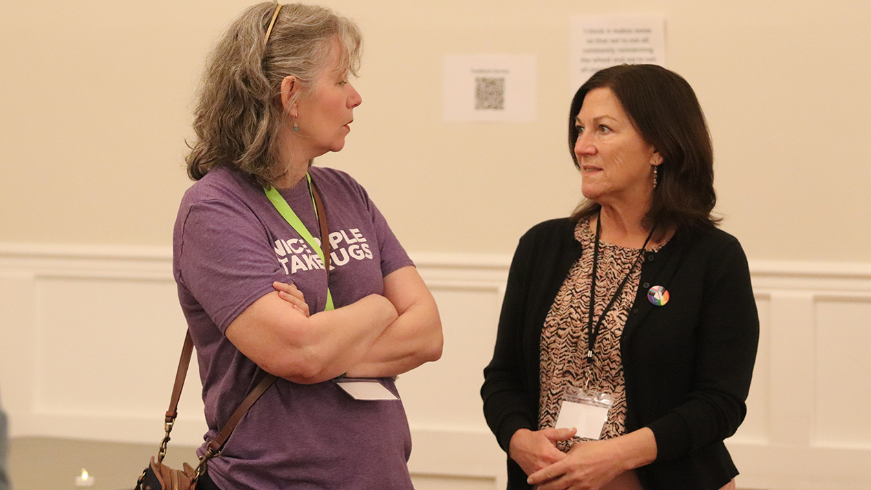 Trail Mayor Colleen Jones and Tammy MacLean chat at the West Kootenay Homelessness Response Summit