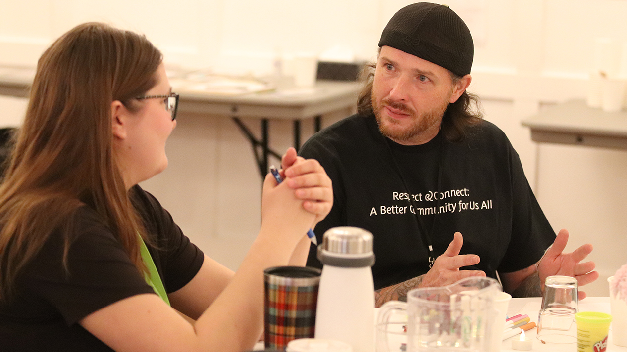 David Tomlen from the Trail Community Action Team in conversation at the West Kootenay Homelessness Response Summit