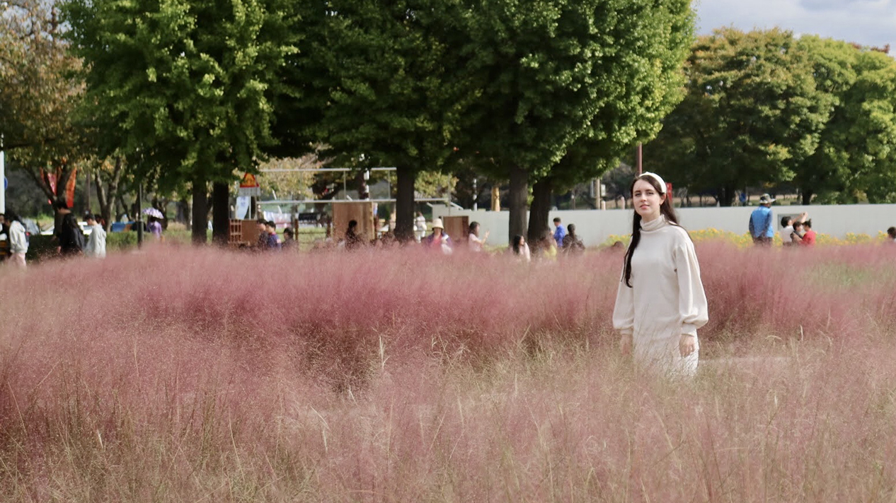Selkirk College student EK Murray in a field in Korea
