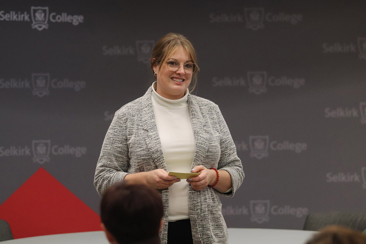 Associate Vice-President, Student Success, Brier Albano stands at a podium