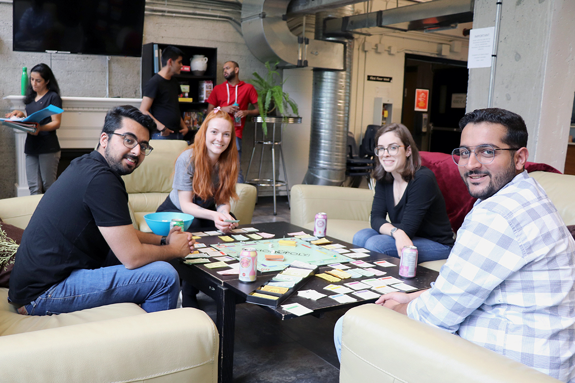 Students play a game of Monopoly in Tenth Street Housing