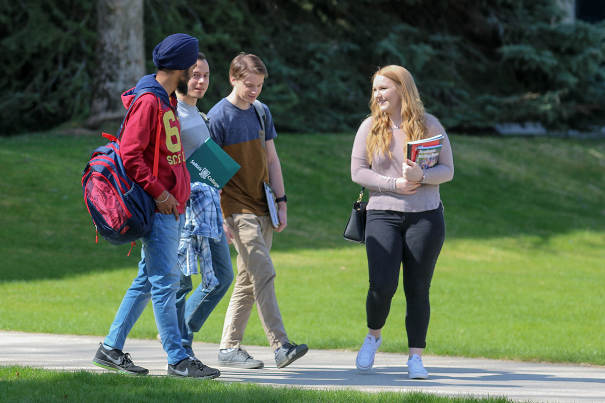 Students walking and talking on campus