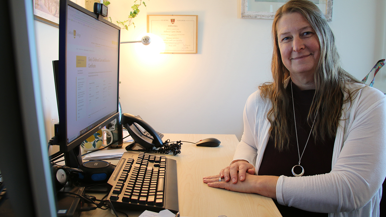 ECCE Instructor Becky Deane at her Computer