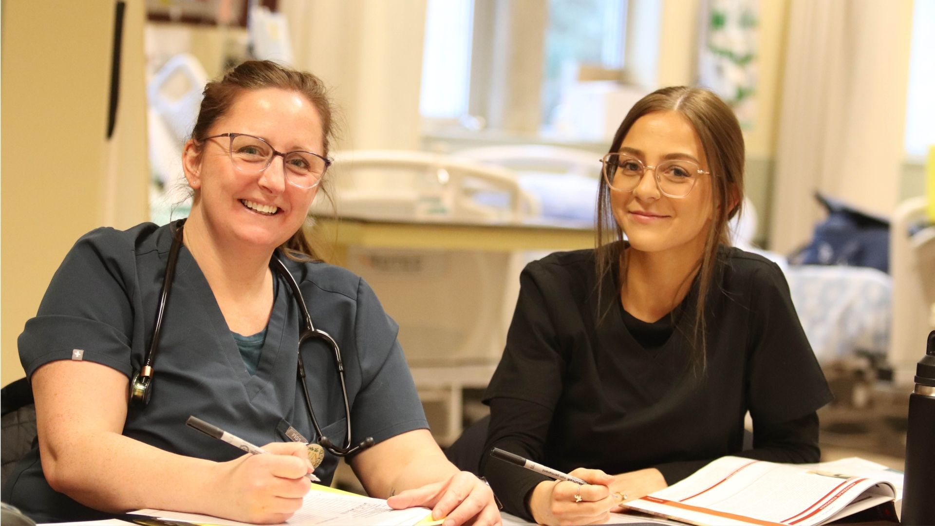 two students sitting side by side