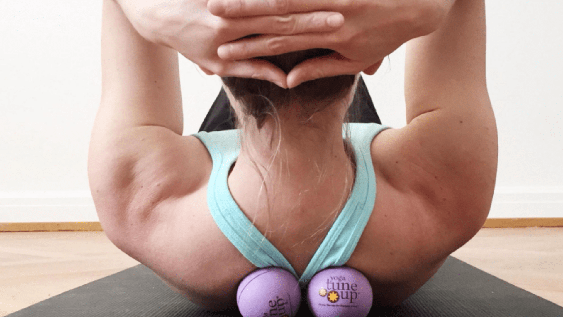 woman using massage therapy balls