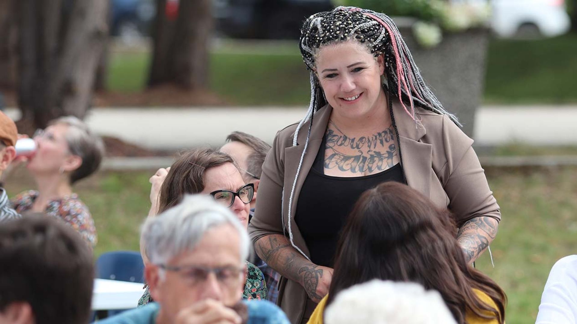 Staff in conversation at bbq