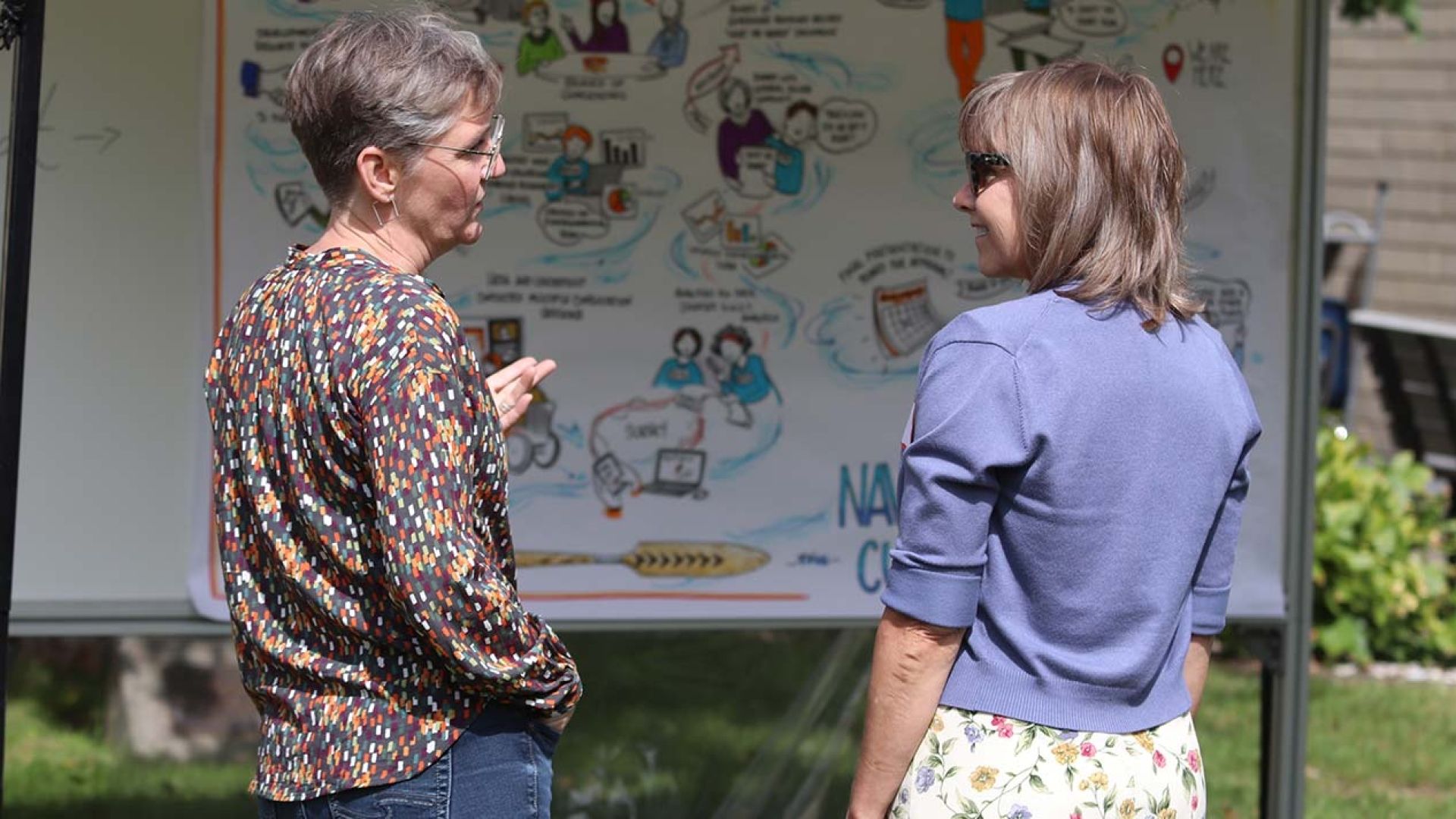 President Maggie Matear in conversation at bbq