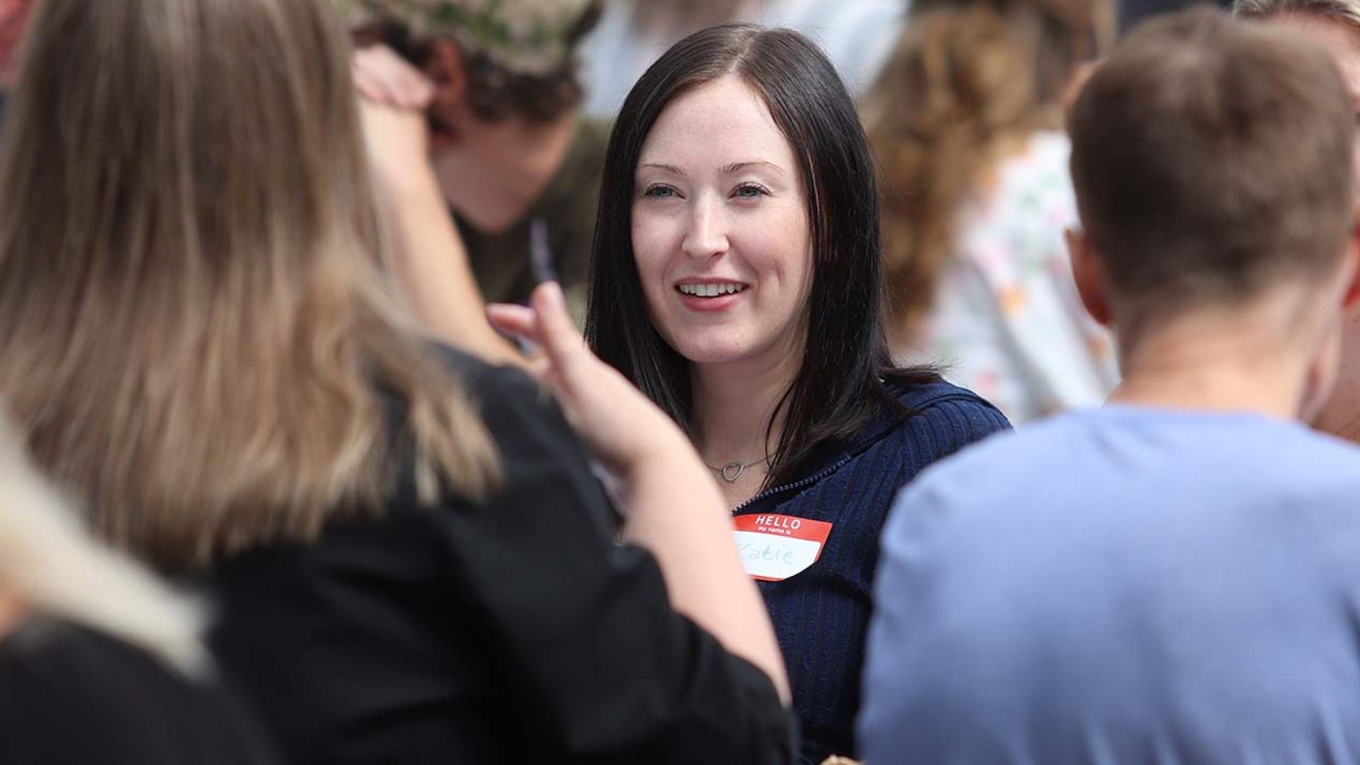 Staff enjoy chatting at welcome back bbq