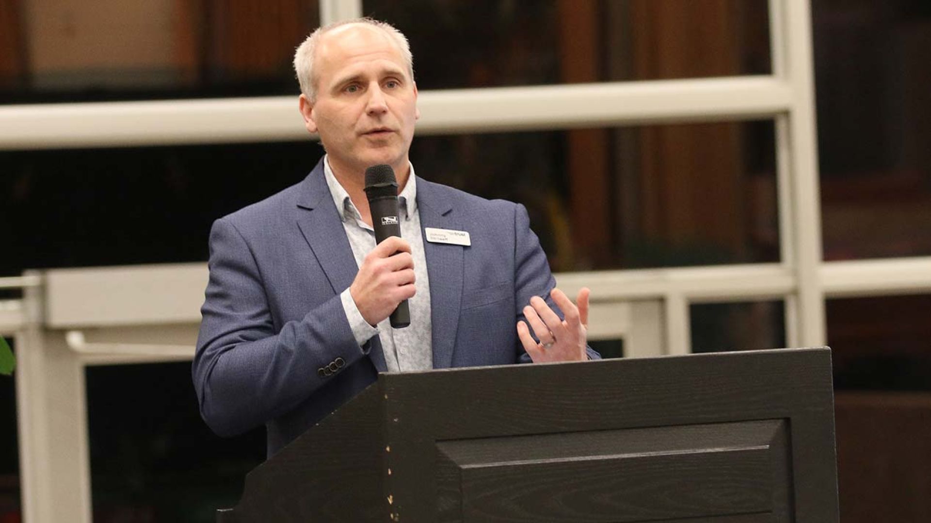 Columbia Basin Trust CEO Johnny Strilaeff at the podium during event