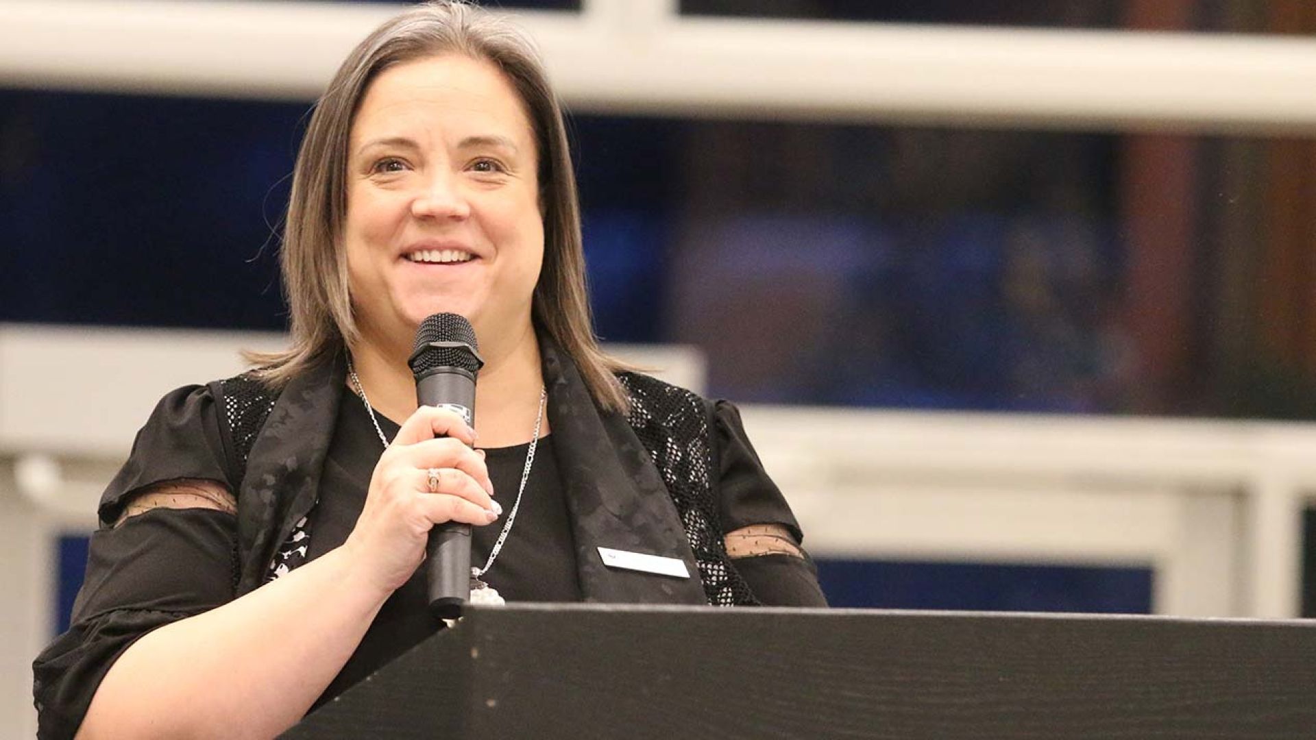 College VP Taya Whitehead at podium