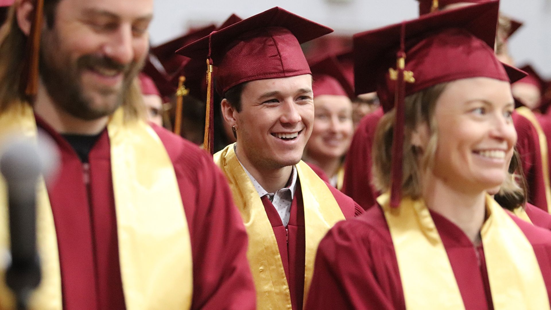 Selkirk College graduate with big smiles