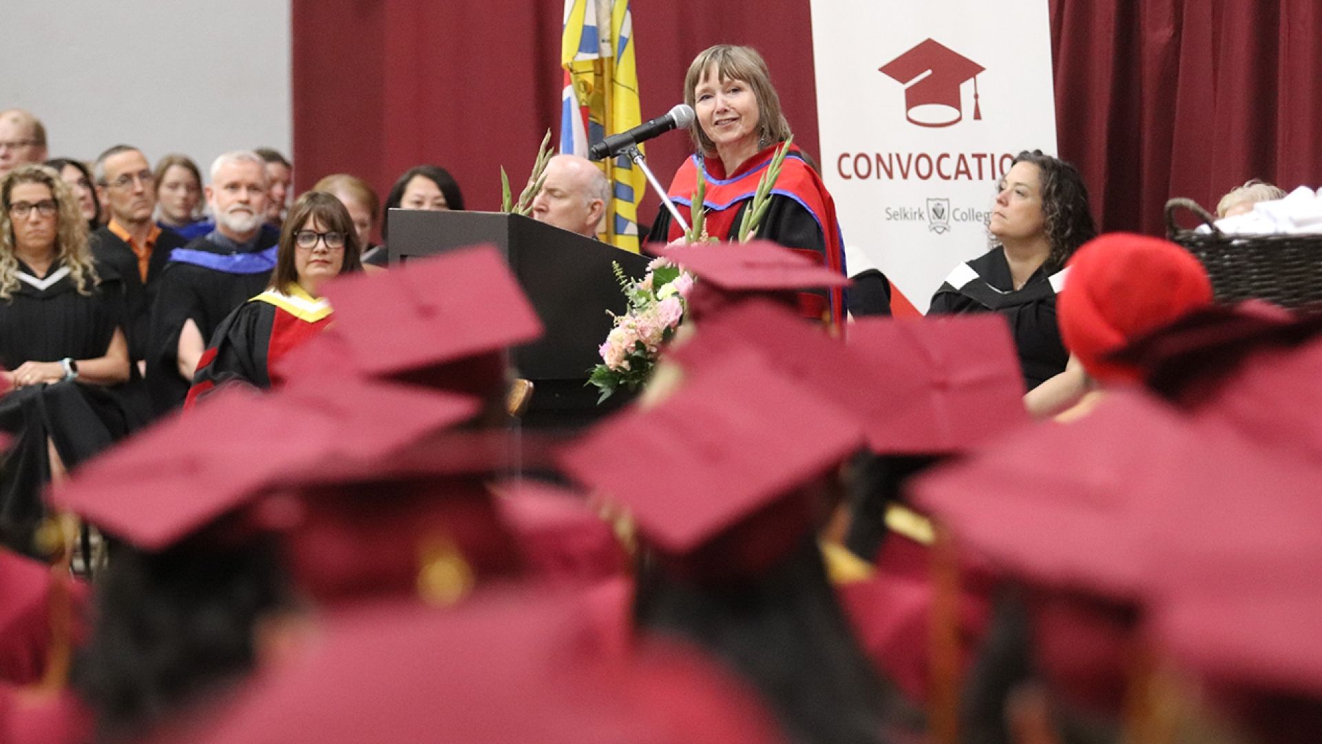 Selkirk College President Maggie Matear speaks to graduates