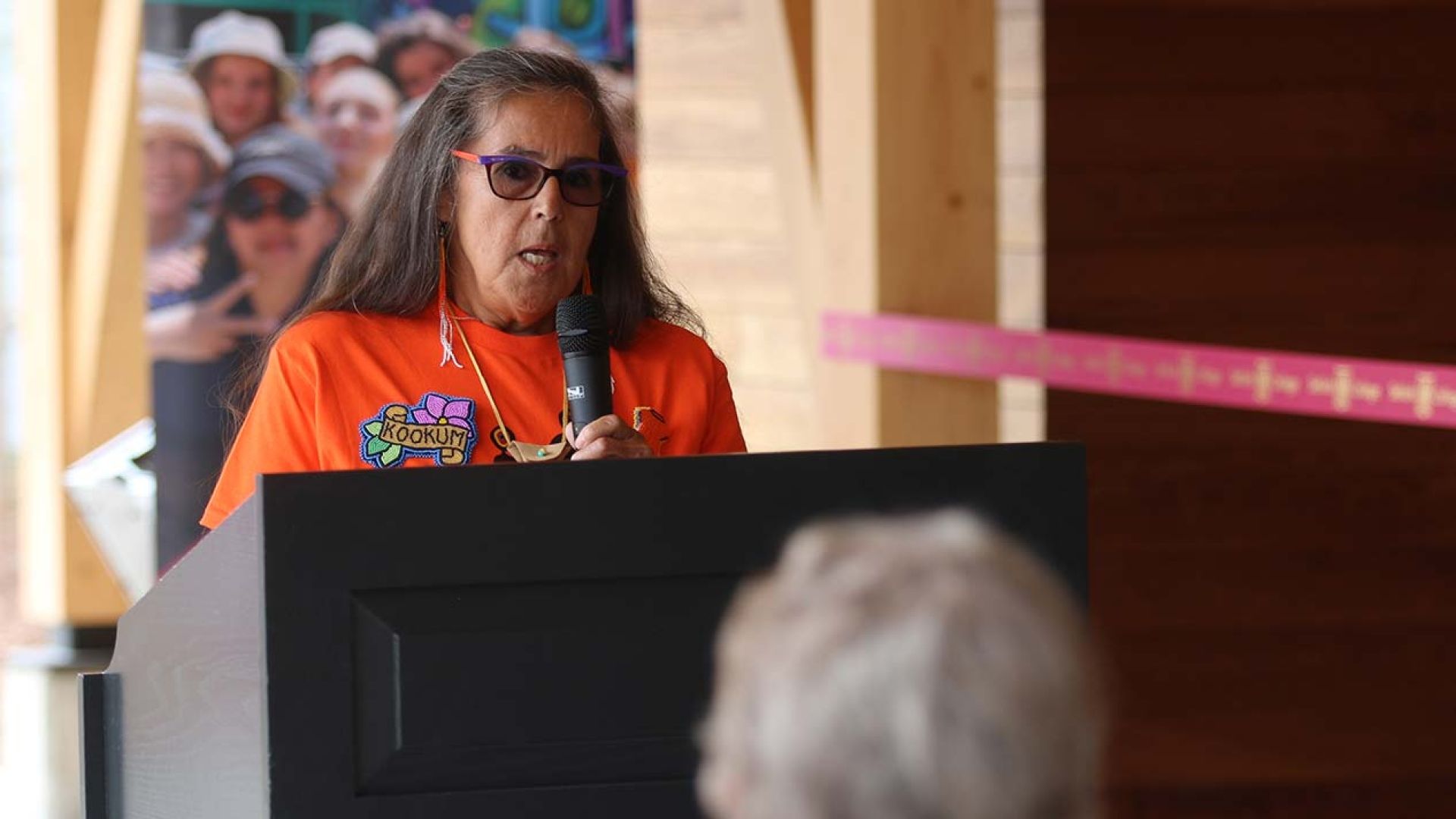 Selkirk College Elder Debbie Bird speaks at the housing opening