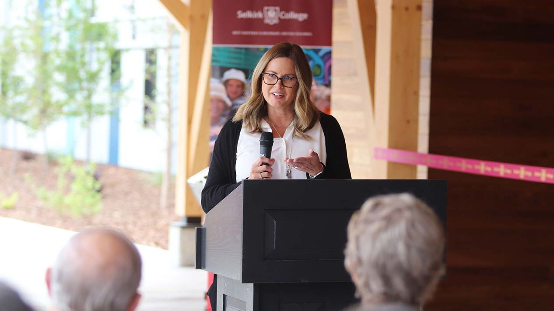 Director of Facilities Donna Drover at the podium