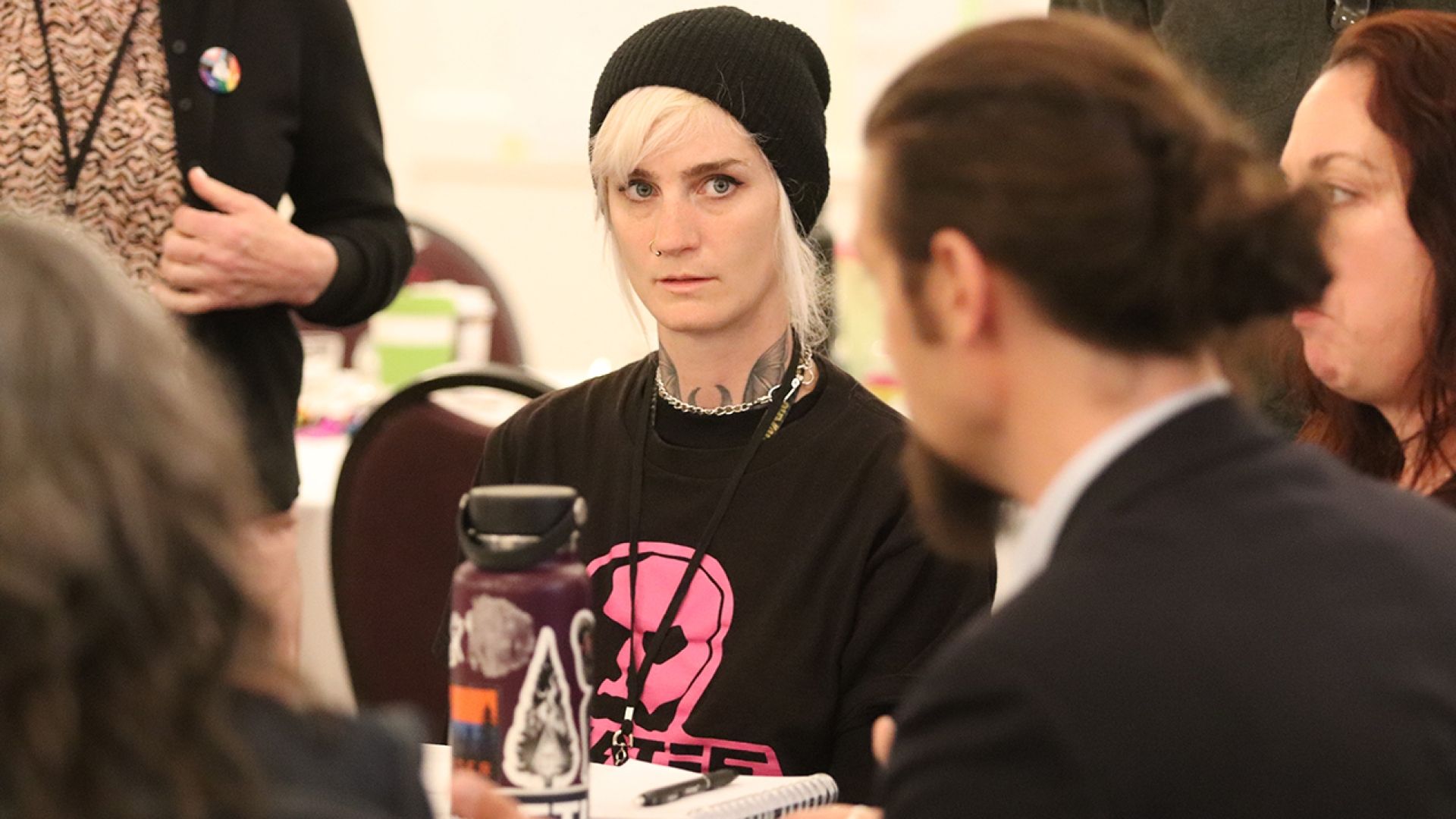 Holly Trider of REDUN listening to another participant sharing information