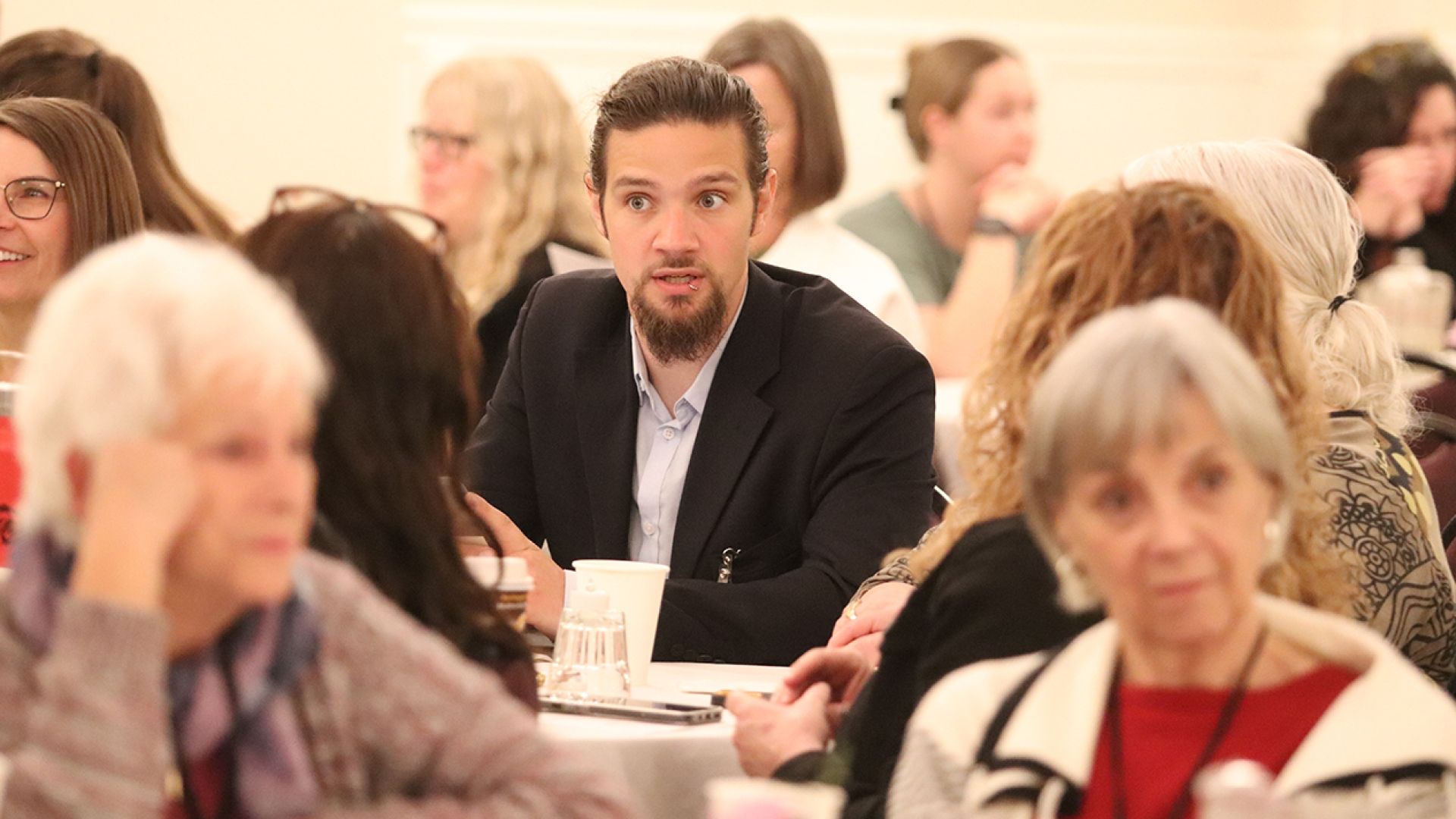 Kenneth Scott of BC Housing engaged in a table conversation