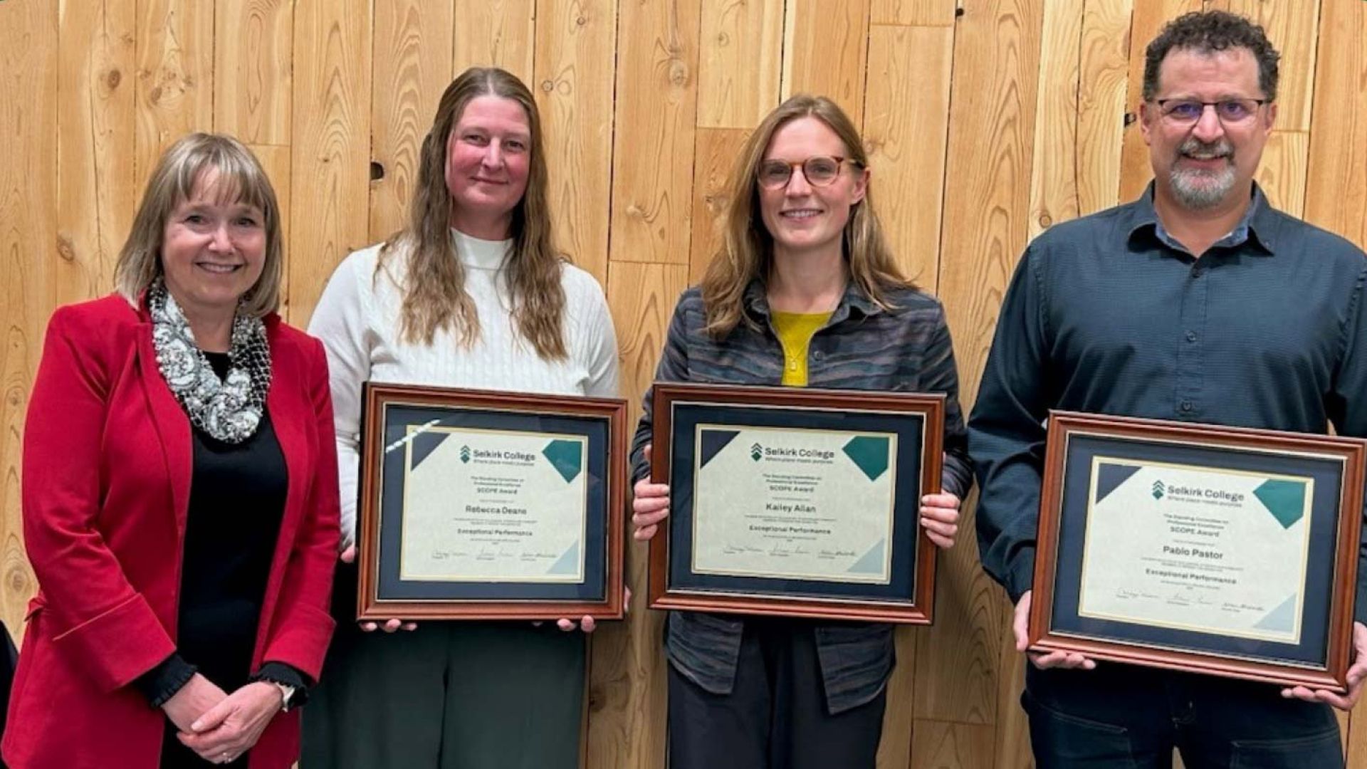 Three SCOPE Award winners stand holding certificates