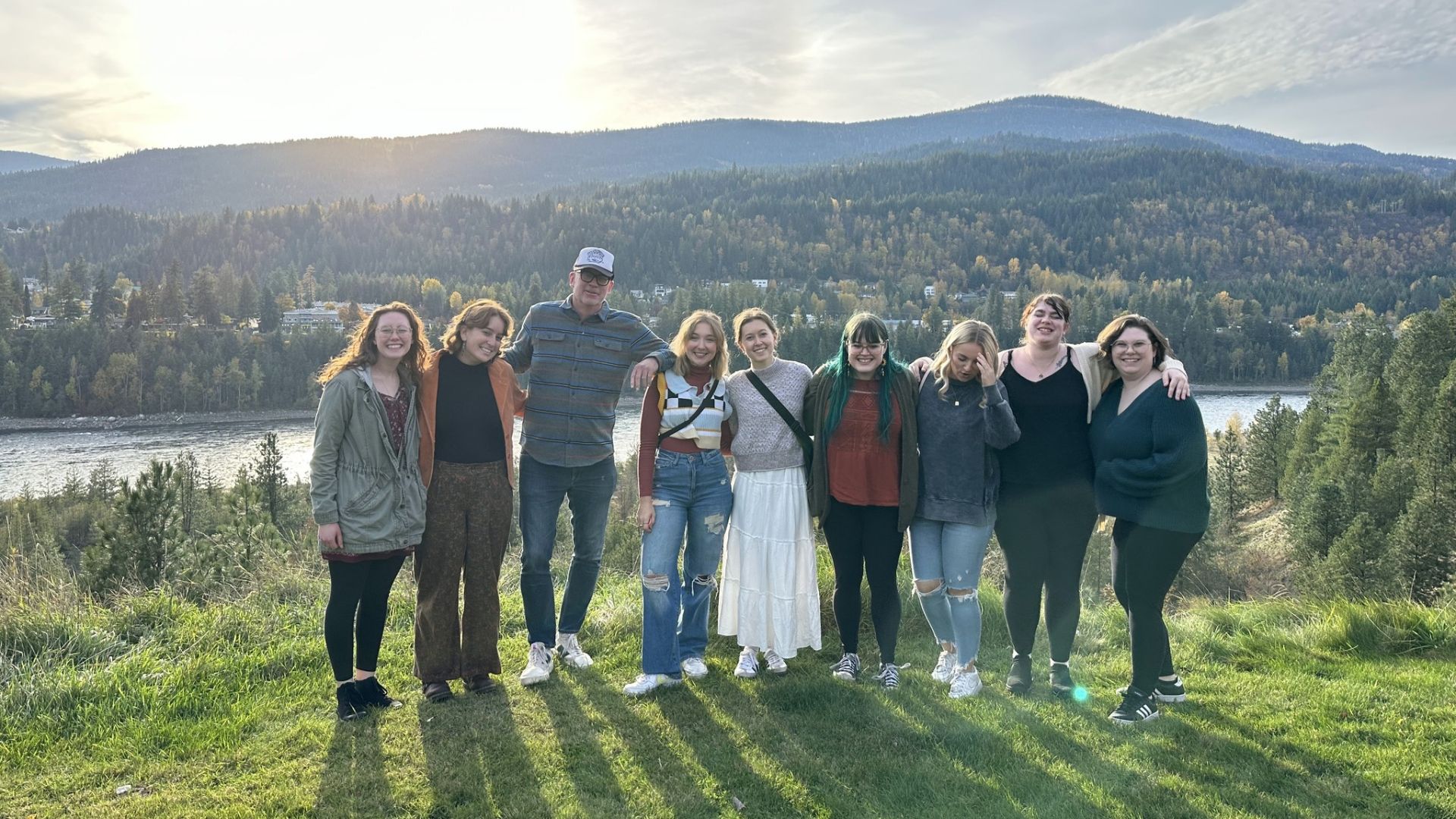 A group of writers stand overlooking the Columbia River.