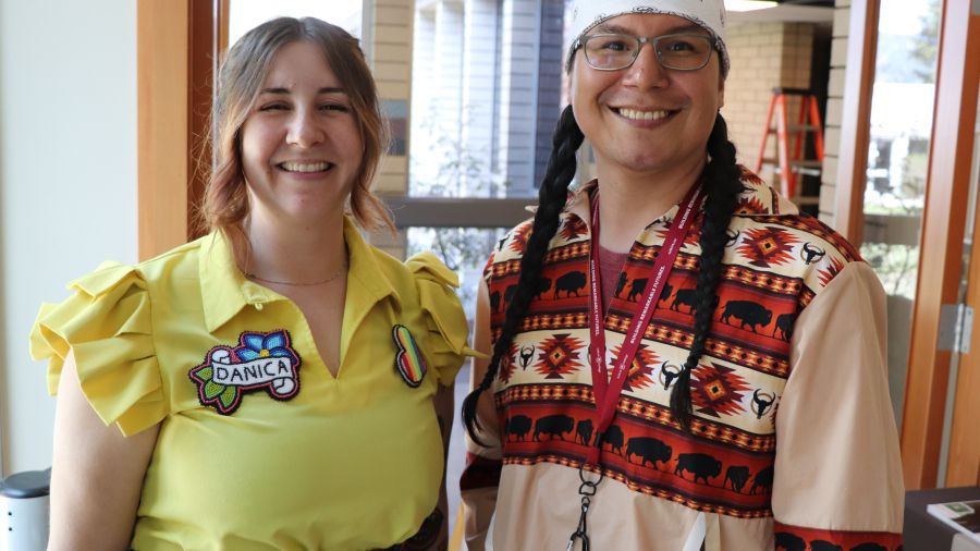 Danica and Rodney standing next to each other and smiling for a photo in the Gathering Place