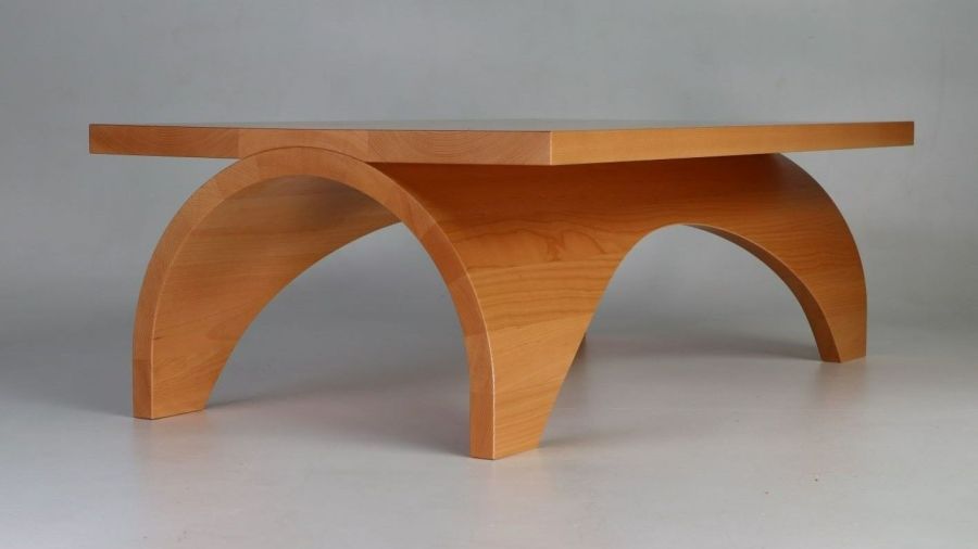 A photo of a low table with curved legs