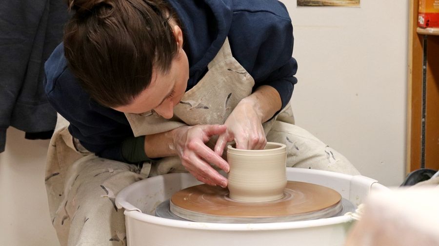 Student on pottery wheel