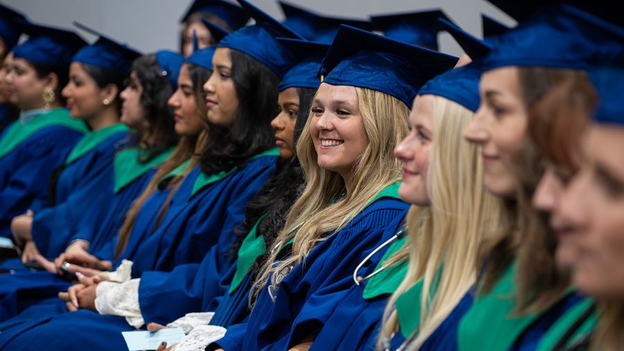 Students at Convocation smiling