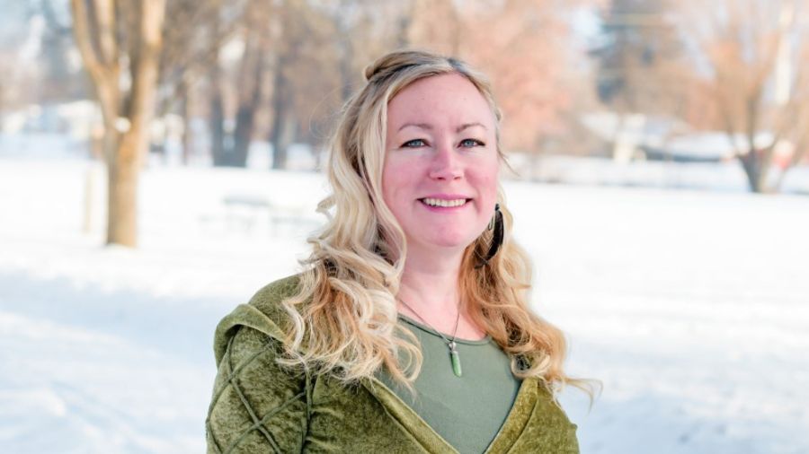 Instructor Holly Hume stands outside in winter