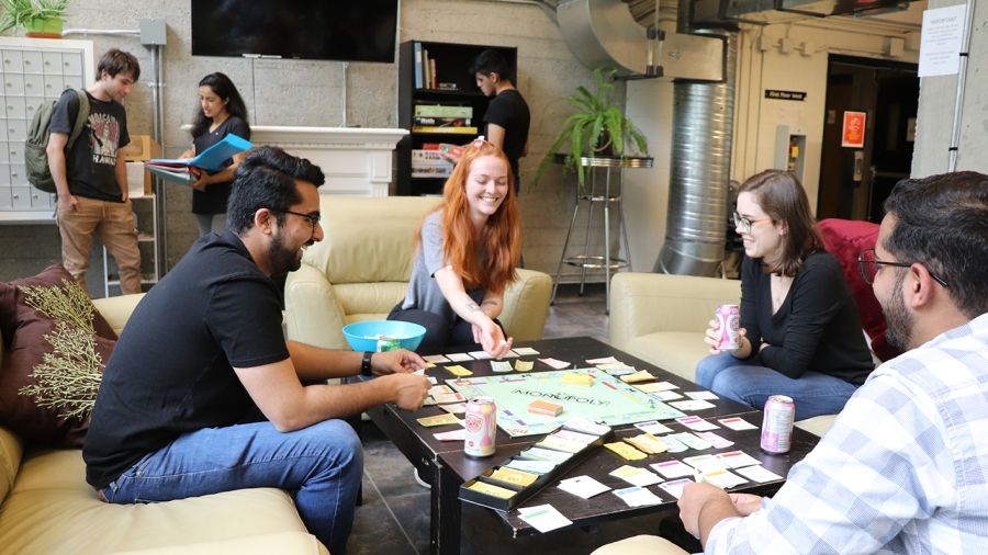 Students playing board games at the Tenth Street Student Housing