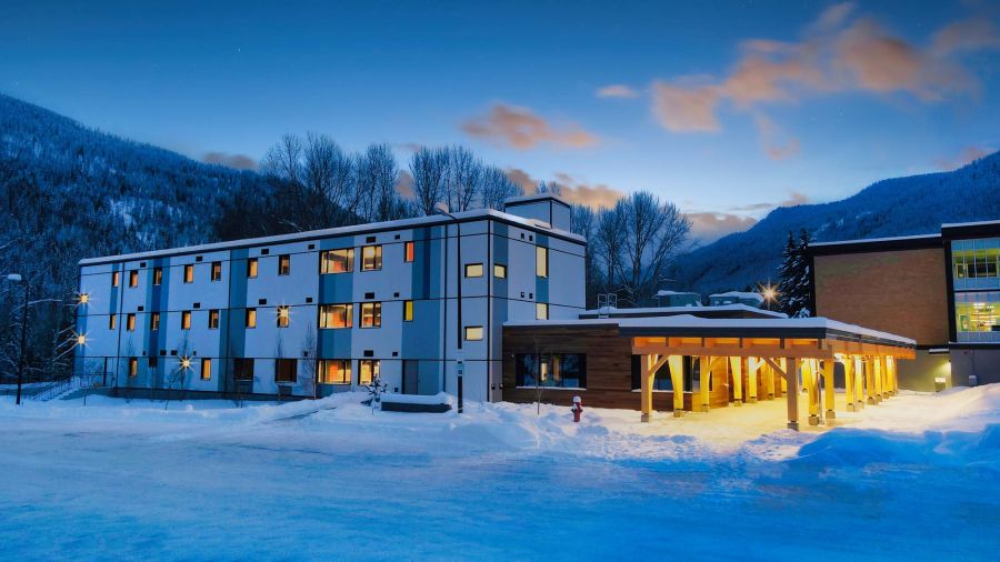 A student housing building against the evening sky