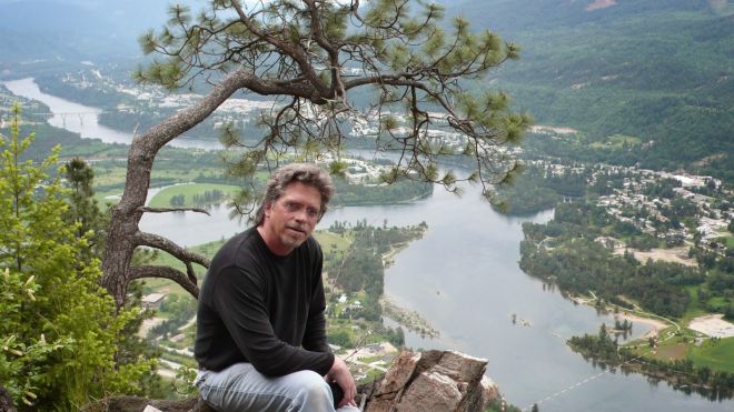 Myler Wilkinson sits outside by the Columbia River