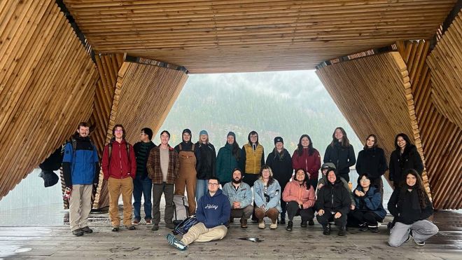 Students stand in the Nelson Pier