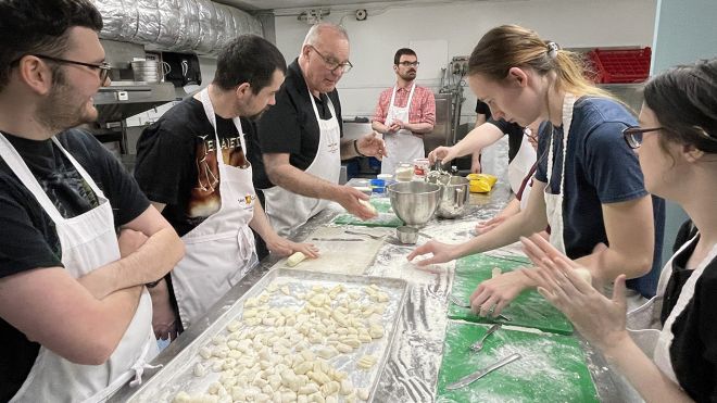 Students make gnocchi together