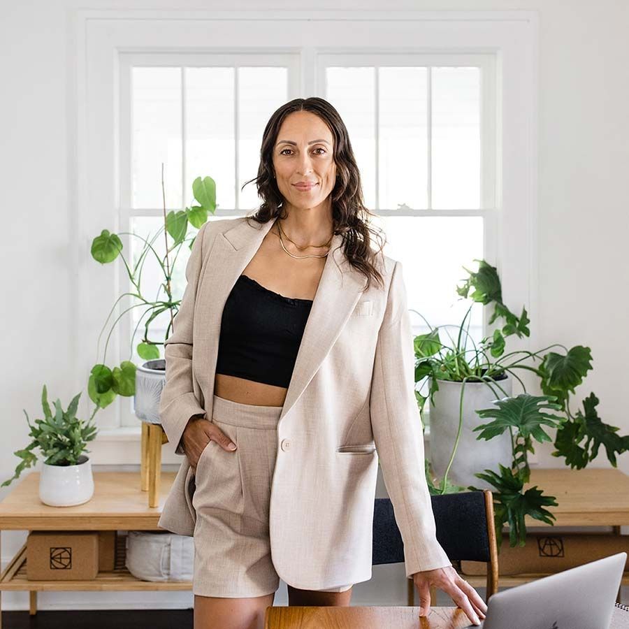 Graduate Kaila Kaufmann stands in an office