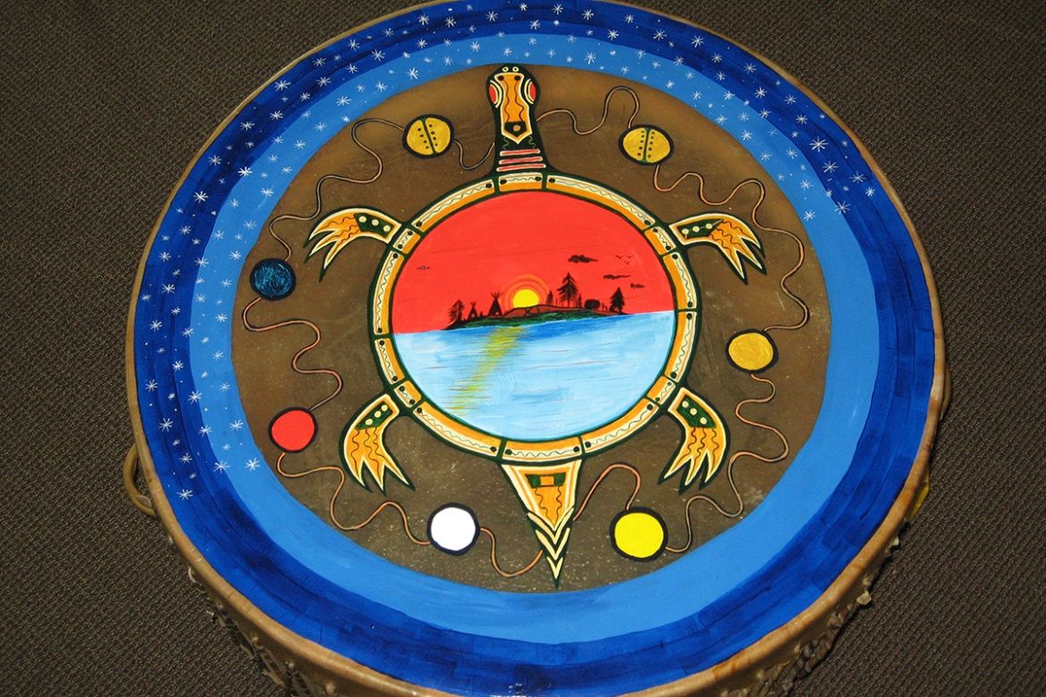 An image of drum with a turtle painted on the drum skin