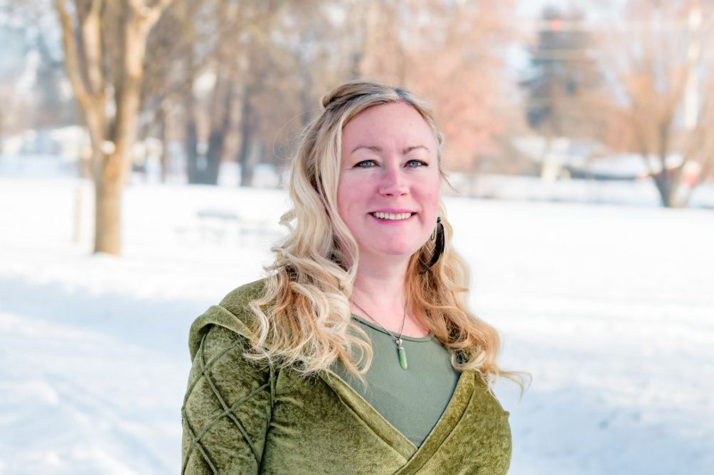 Instructor Holly Hume stands outside in winter