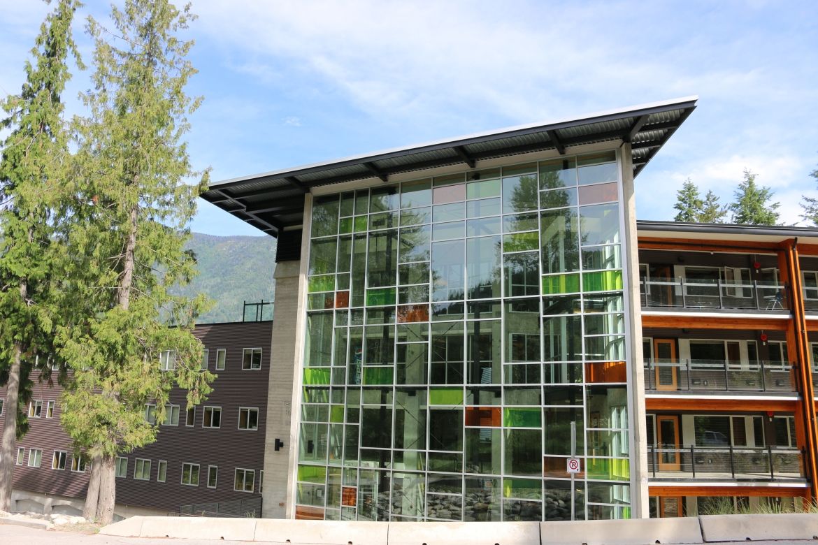 The exterior of the Tenth Street Student Housing Building with large windows