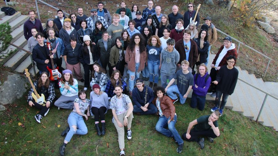 A group of music students gathered outside