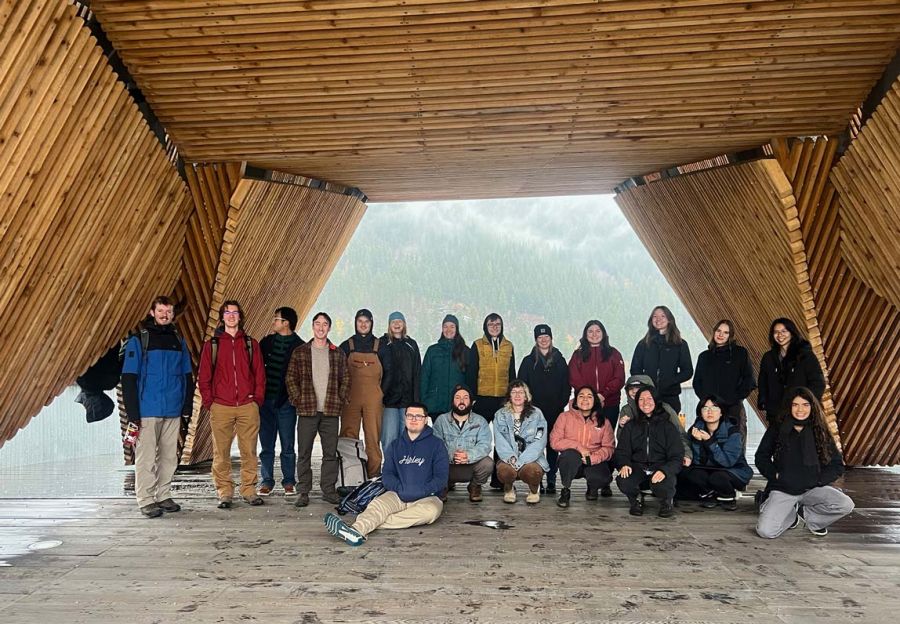 Students stand in the Nelson Pier