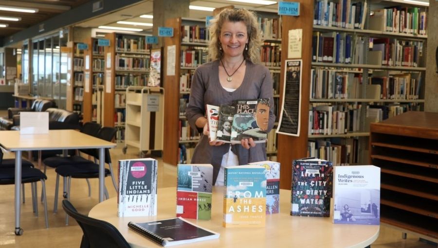 Jennie Barron with a selection of books for Selkirk Reads