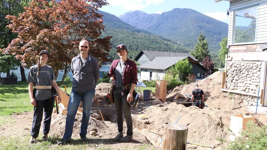 Ellenwood Homes crew members Jessica McLeod, Marc Brillon and Meredith Vezina stand at a jobsite on the North Shore of Kootenay Lake.
