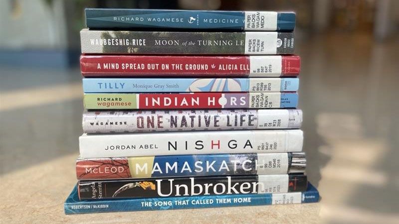 A stack of Selkirk Reads! books in the library